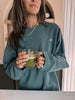 beige hour sunday morning oversized sweatshirt in forest paired with matcha tea