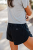 sunrise performance shorts in black by beige hour